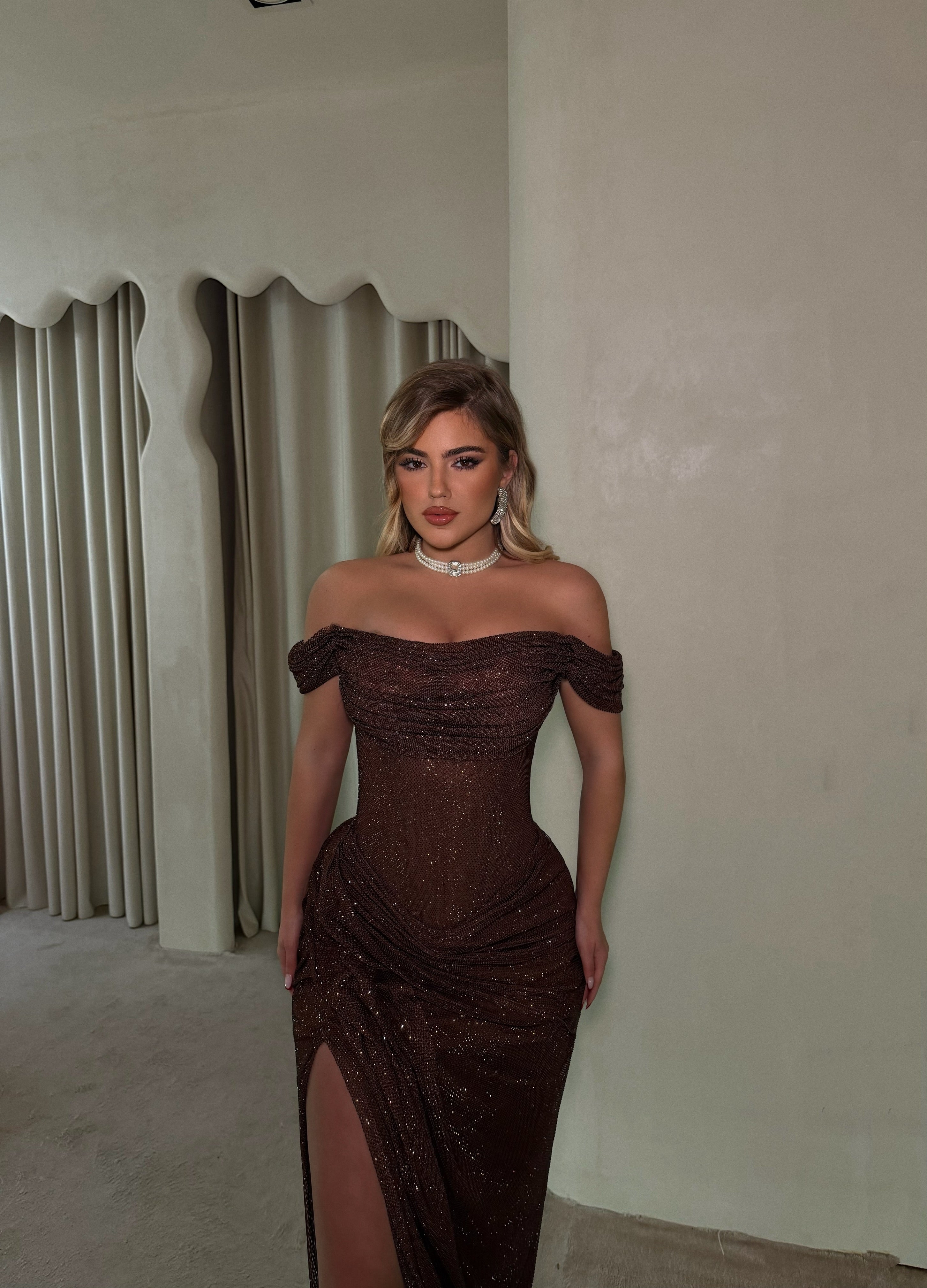 MAGIC IN BROWN GOWN